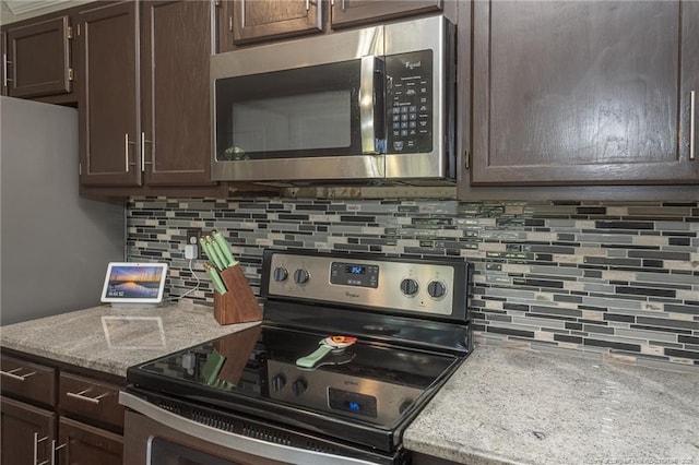 5411 Archer Rd, Hope Mills, NC 28348 - kitchen featuring stainless steel appliances, backsplash, and dark brown cabinets