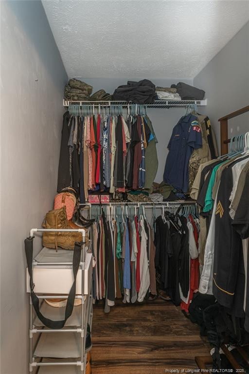 5411 Archer Rd, Hope Mills, NC 28348 - spacious closet featuring wood finished floors and lofted ceiling