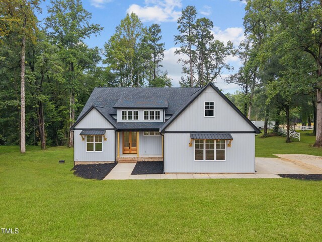 5027 Preacher Holmes Rd, Graham, NC 27253 - modern farmhouse featuring a shingled roof, a front yard, and french doors