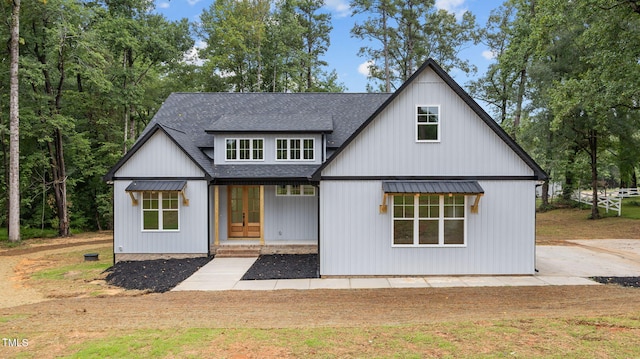 5027 Preacher Holmes Rd, Graham, NC 27253 - modern farmhouse style home with french doors and a shingled roof