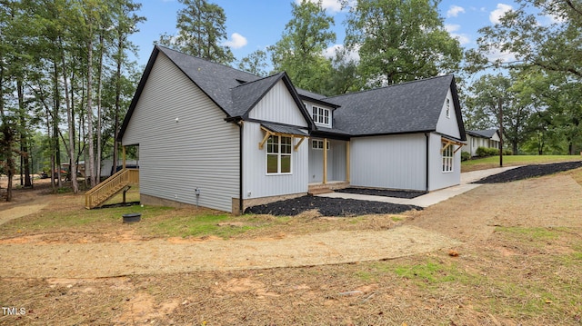 5027 Preacher Holmes Rd, Graham, NC 27253 - view of front facade featuring roof with shingles and stairway