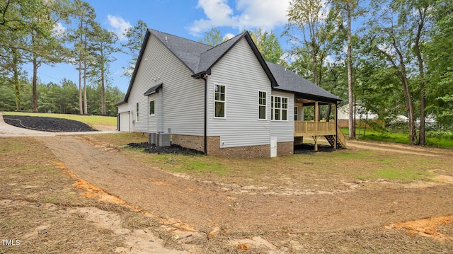 5027 Preacher Holmes Rd, Graham, NC 27253 - view of side of home featuring driveway, stairway, a shingled roof, a garage, and crawl space