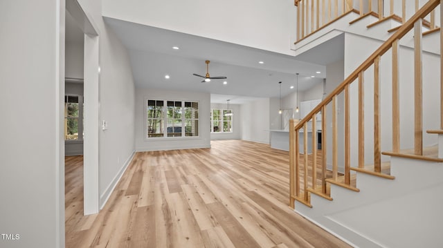5027 Preacher Holmes Rd, Graham, NC 27253 - unfurnished living room featuring recessed lighting, stairway, wood finished floors, and ceiling fan