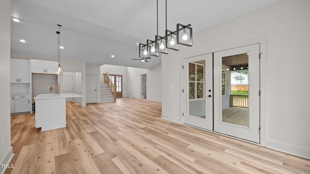 5027 Preacher Holmes Rd, Graham, NC 27253 - unfurnished dining area featuring french doors, stairway, light wood-style floors, and recessed lighting
