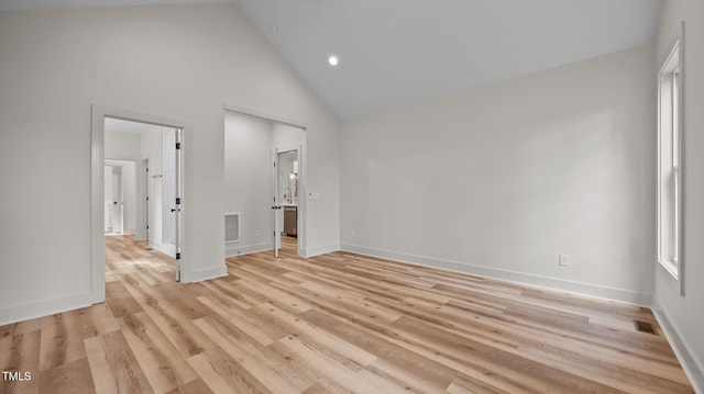 5027 Preacher Holmes Rd, Graham, NC 27253 - unfurnished bedroom with high vaulted ceiling, light wood-style floors, recessed lighting, and ensuite bathroom