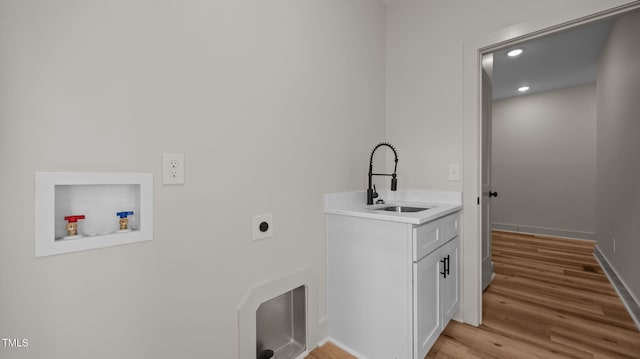 5027 Preacher Holmes Rd, Graham, NC 27253 - laundry room with cabinet space, washer hookup, electric dryer hookup, light wood finished floors, and recessed lighting