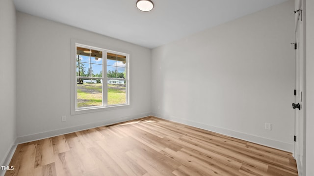 5027 Preacher Holmes Rd, Graham, NC 27253 - spare room featuring light wood-style flooring and baseboards