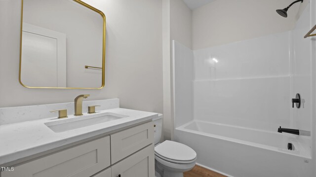 5027 Preacher Holmes Rd, Graham, NC 27253 - full bath with vanity, shower / washtub combination, and wood finished floors