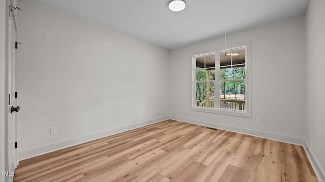 5027 Preacher Holmes Rd, Graham, NC 27253 - spare room with baseboards and wood finished floors