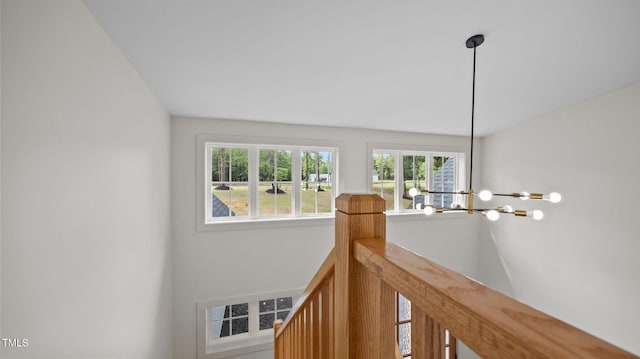 5027 Preacher Holmes Rd, Graham, NC 27253 - corridor featuring a chandelier
