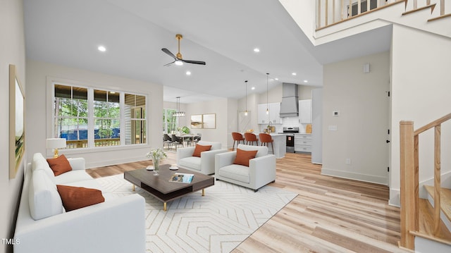 5027 Preacher Holmes Rd, Graham, NC 27253 - living area featuring stairway, light wood-style floors, recessed lighting, ceiling fan, and high vaulted ceiling