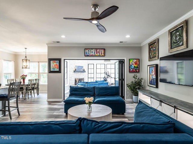 3441 Jordan Shires Dr, New Hill, NC 27562 - living area featuring recessed lighting, ornamental molding, ceiling fan, and wood finished floors