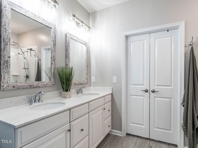 3441 Jordan Shires Dr, New Hill, NC 27562 - full bath featuring double vanity, a tile shower, and wood finished floors