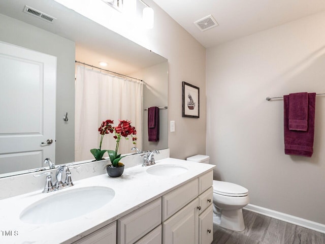 3441 Jordan Shires Dr, New Hill, NC 27562 - full bathroom with double vanity, wood finished floors, and a shower with shower curtain