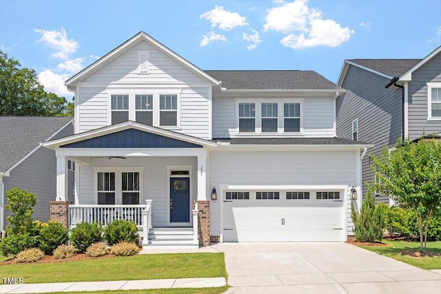 223 Chauncey Cir, Chapel Hill, NC 27516 - craftsman-style home with a garage, a porch, driveway, and a shingled roof