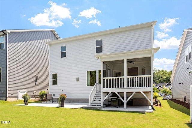 223 Chauncey Cir, Chapel Hill, NC 27516 - back of house featuring a patio area, a sunroom, a lawn, a ceiling fan, and stairs