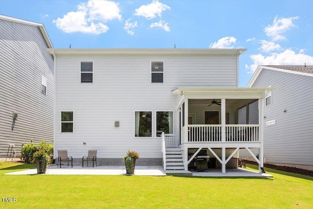 223 Chauncey Cir, Chapel Hill, NC 27516 - back of house with a patio, a ceiling fan, a lawn, and a sunroom