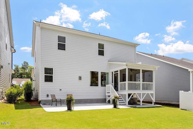 223 Chauncey Cir, Chapel Hill, NC 27516 - rear view of property with a patio area, a lawn, a sunroom, and a ceiling fan