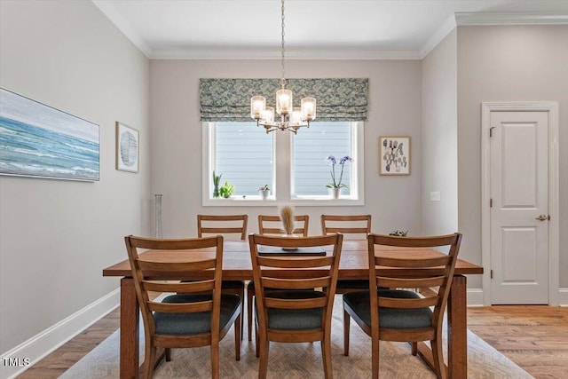 223 Chauncey Cir, Chapel Hill, NC 27516 - dining room with wood finished floors, a chandelier, and crown molding