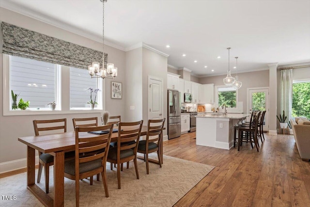 223 Chauncey Cir, Chapel Hill, NC 27516 - dining area featuring crown molding, a chandelier, light wood-type flooring, and recessed lighting