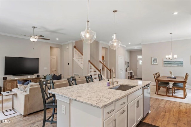 223 Chauncey Cir, Chapel Hill, NC 27516 - kitchen featuring light wood-style flooring, recessed lighting, white cabinets, crown molding, and a ceiling fan