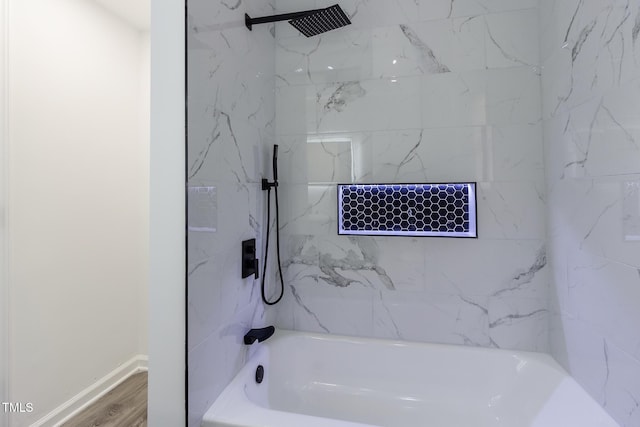 400 Minchew St SE, Wilson, NC 27893 - bathroom featuring shower / washtub combination and wood finished floors