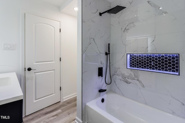 400 Minchew St SE, Wilson, NC 27893 - bathroom featuring vanity, shower / bathtub combination, and wood finished floors