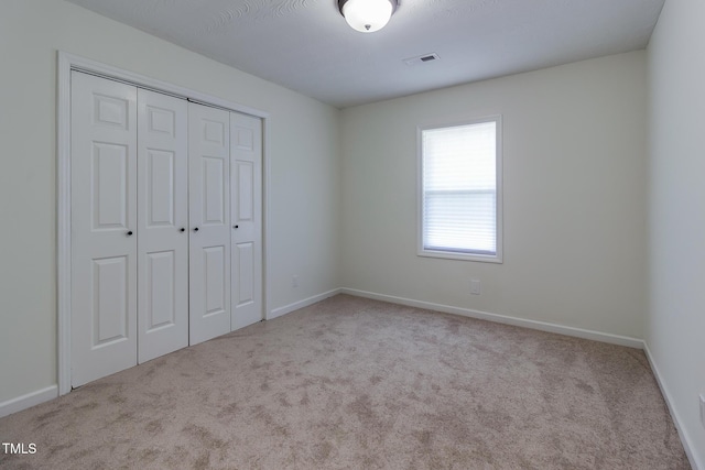 400 Minchew St SE, Wilson, NC 27893 - unfurnished bedroom featuring carpet floors and a closet