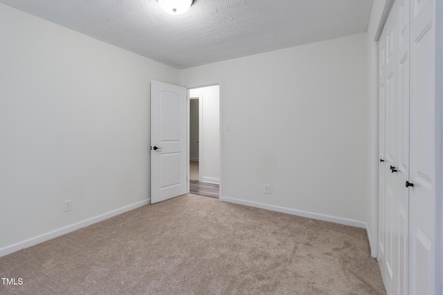 400 Minchew St SE, Wilson, NC 27893 - unfurnished bedroom featuring a closet and carpet