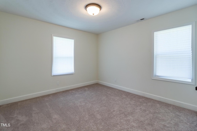 400 Minchew St SE, Wilson, NC 27893 - carpeted empty room with baseboards