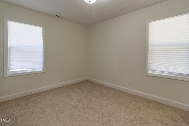400 Minchew St SE, Wilson, NC 27893 - carpeted spare room featuring baseboards
