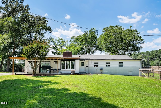 6005 Lake Wheeler Rd, Raleigh, NC 27603 - rear view of property with a chimney and a patio area
