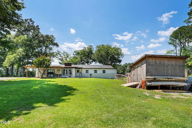 6005 Lake Wheeler Rd, Raleigh, NC 27603 - rear view of house with a lawn