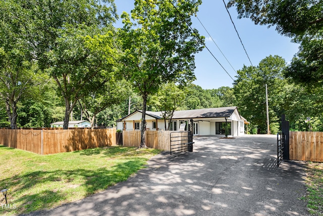 6005 Lake Wheeler Rd, Raleigh, NC 27603 - view of front of home featuring driveway, a fenced front yard, and a gate