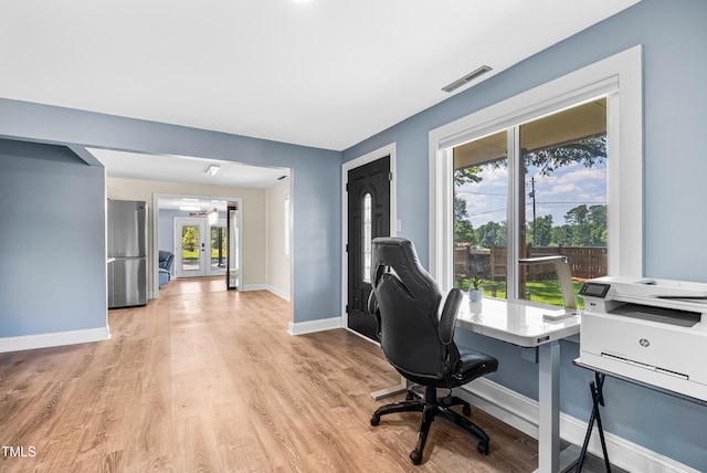 6005 Lake Wheeler Rd, Raleigh, NC 27603 - office area featuring healthy amount of natural light, light wood finished floors, and french doors