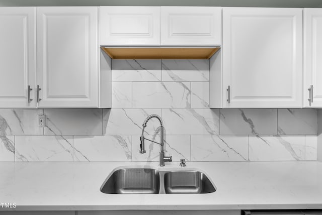 6005 Lake Wheeler Rd, Raleigh, NC 27603 - kitchen with light countertops, white cabinetry, and tasteful backsplash