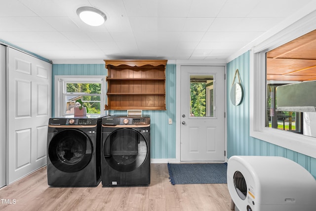 6005 Lake Wheeler Rd, Raleigh, NC 27603 - washroom featuring washing machine and dryer and light wood-style flooring