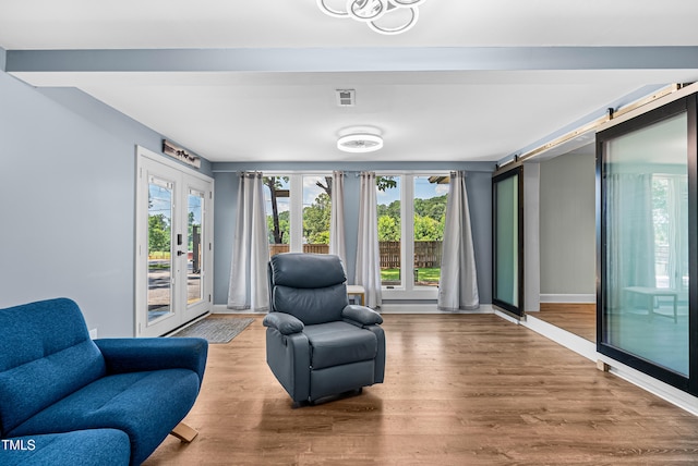 6005 Lake Wheeler Rd, Raleigh, NC 27603 - living area featuring plenty of natural light and wood finished floors