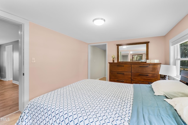 6005 Lake Wheeler Rd, Raleigh, NC 27603 - bedroom featuring wood finished floors and baseboards