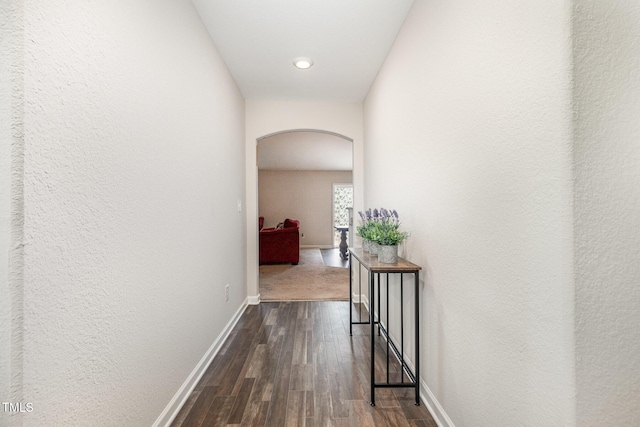 2040 Alderman Way, Creedmoor, NC 27522 - hallway featuring arched walkways, dark wood finished floors, a textured wall, and recessed lighting