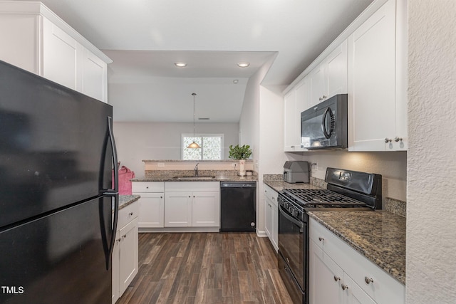 2040 Alderman Way, Creedmoor, NC 27522 - kitchen featuring black appliances, dark wood-type flooring, white cabinets, dark stone countertops, and a peninsula