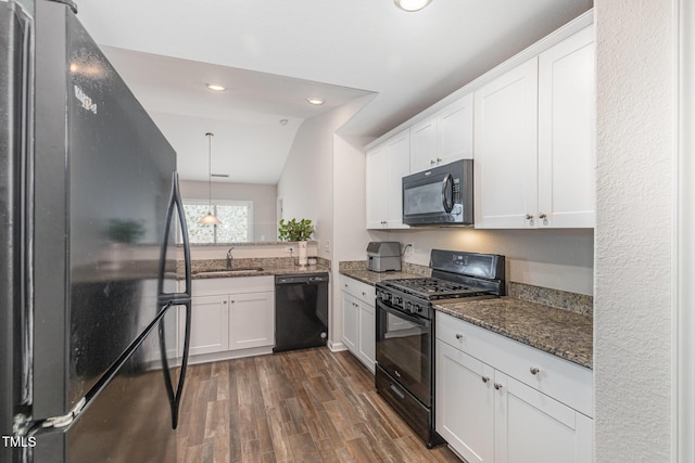 2040 Alderman Way, Creedmoor, NC 27522 - kitchen featuring black appliances, dark stone countertops, dark wood-style flooring, white cabinetry, and recessed lighting