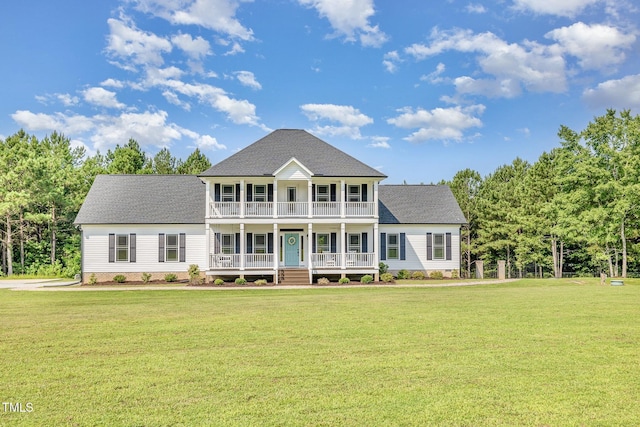 407 Kadir Womble Dr, New Hill, NC 27562 - view of front of property featuring covered porch, a balcony, a front lawn, and a shingled roof