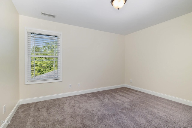 407 Kadir Womble Dr, New Hill, NC 27562 - carpeted empty room with baseboards