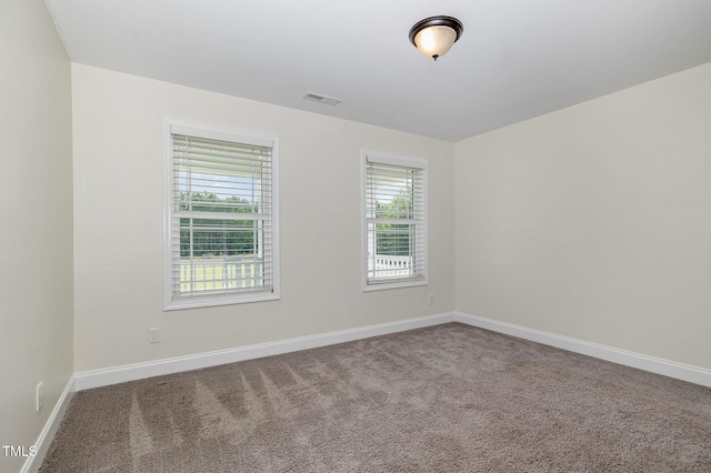 407 Kadir Womble Dr, New Hill, NC 27562 - carpeted empty room featuring baseboards