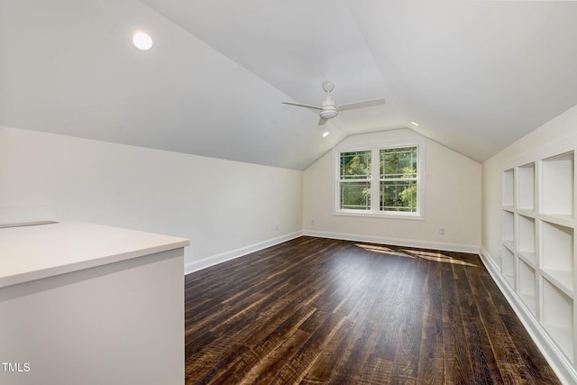 407 Kadir Womble Dr, New Hill, NC 27562 - bonus room featuring dark wood-type flooring, lofted ceiling, a ceiling fan, and built in features