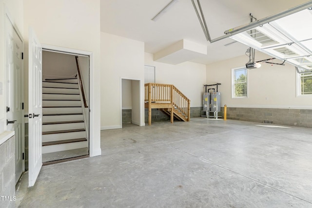 407 Kadir Womble Dr, New Hill, NC 27562 - garage featuring a garage door opener and water heater