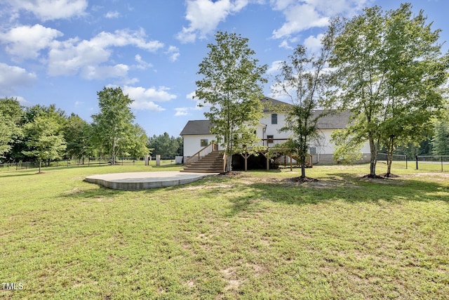 407 Kadir Womble Dr, New Hill, NC 27562 - fenced backyard featuring a wooden deck and stairs