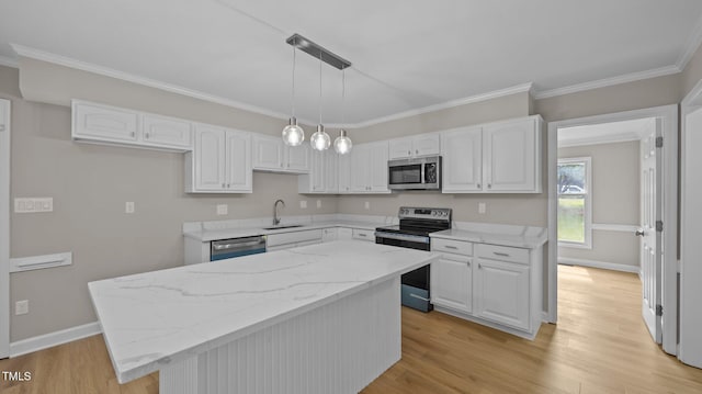1524 Wedgewood Dr, Graham, NC 27253 - kitchen featuring appliances with stainless steel finishes, white cabinets, light stone countertops, light wood-style flooring, and ornamental molding