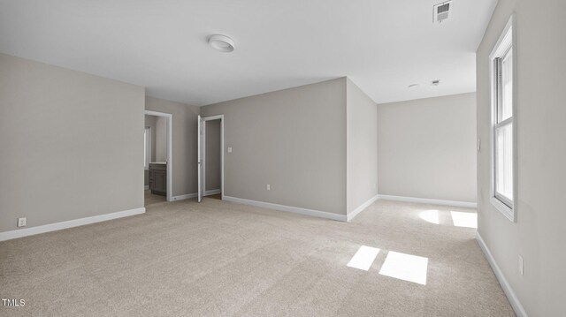 1524 Wedgewood Dr, Graham, NC 27253 - spare room featuring light carpet and baseboards